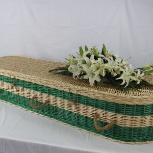 Green willow coffin with white lilies